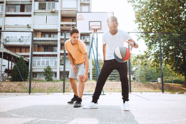 istock Friends playing basketball 1412228775