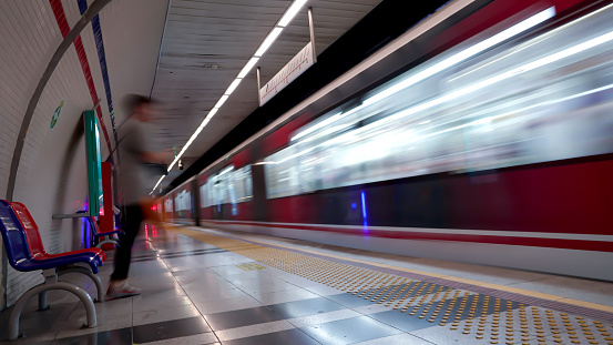 People are in a subway station in Konak, Izmir, Turkey on July 30, 2022. Photos were taken with long exposure.