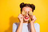 istock Photo of sweet pretty lady wear long sleeve holding two biscuits close eyes isolated yellow color background 1412229627