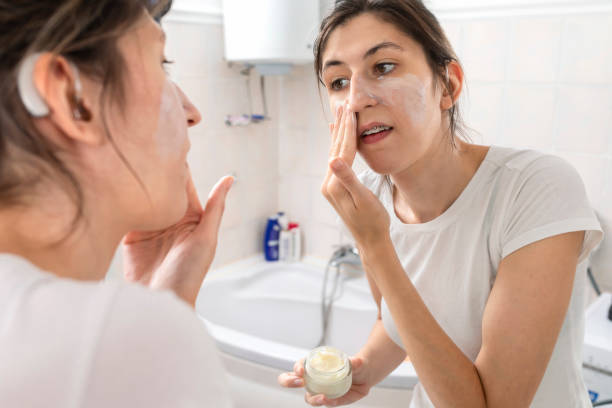 istock A young woman with cochlear implant  getting ready in the bathroom 1412230616