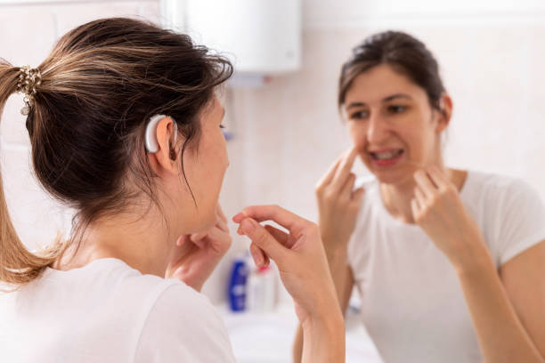 istock Young woman is brushing her teeth in a bathroom 1412230718