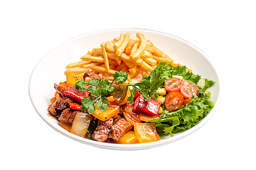 French Fries with shaky beef, vegetables served on a white plate high resolution stock photo