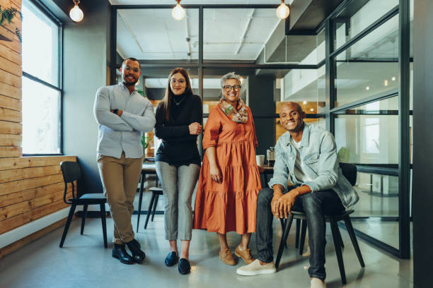 istock Successful business colleagues smiling at the camera in an office 1412232574
