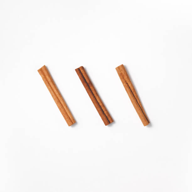 istock Three cinnamon sticks diagonally in the center. 1412232834