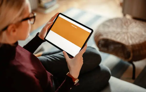 Photo of Close Up Photo Of Woman Hands Using A Digital Tablet For Online Banking