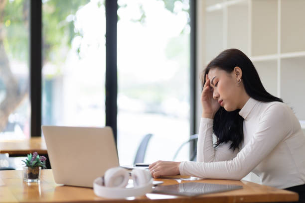 istock The woman in the office is depressed and exhausted from work. 1412233711