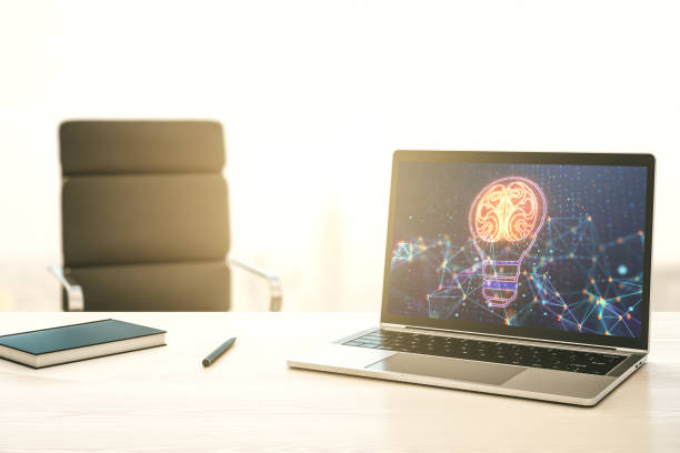 istock Modern computer monitor with creative light bulb hologram with human brain, idea and brainstorming concept. 3D Rendering 1412233776