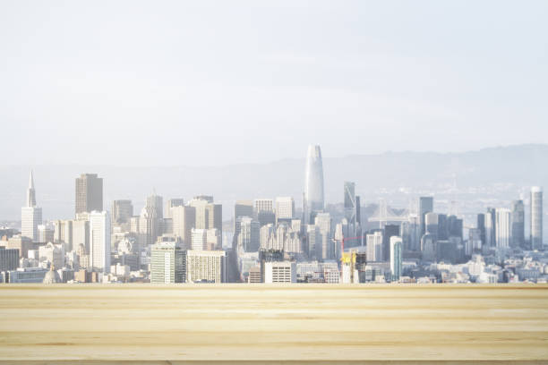 istock Empty wooden tabletop with beautiful San Francisco skyscrapers at daytime on background, mock up 1412234185