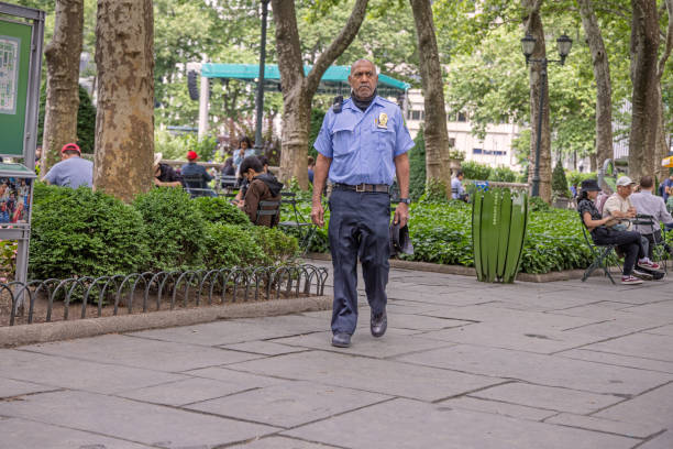 British Police officer enforcing crowd control.