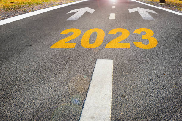 istock Year 2023 with arrow sign marking on road surface for future ahead 1412242781