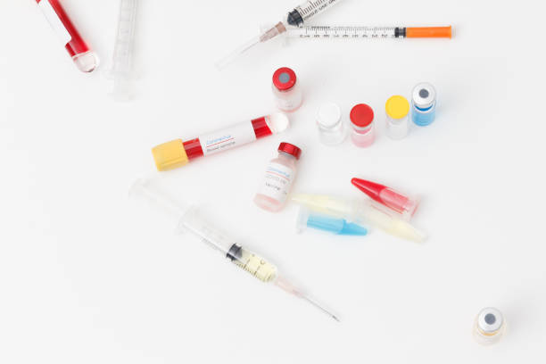 istock Research and development concept, Close up  covid-19(corona virus) blood sample and vaccine at lab. 1412244508