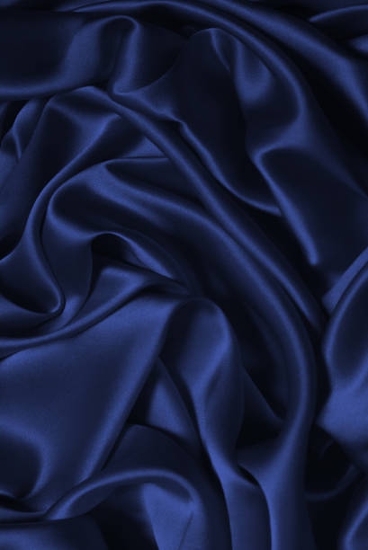 istock Red silk or satin luxury fabric texture can use as abstract background. 1412244710