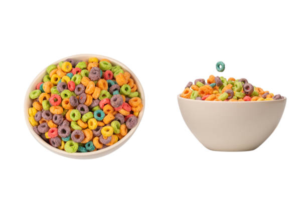 istock Colorful rings cereal spill out into a bowl. Breakfast. Isolated. 1412244730