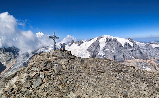 Summit cross on the Bifertenstock Piz Durschin. Fantastic view of the Piz Russein Todi. Glacier tour in the Glarus Alps