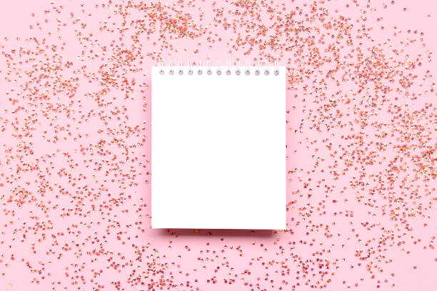 istock White clear notepad mockup with shiny crystals confetti. 1412245829