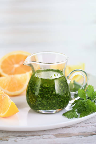 istock Green sauce, cilantro seasoning for salad dressing 1412246346
