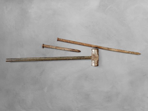 istock Mason's hammer and chisel on cement floor 1412246526