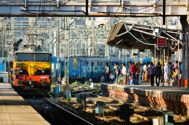 Mumbai, Maharashtra, India  March 2, 2015: Commuters waiting for train to arrive at Chhatrapati Shivaji Terminus Railway Station