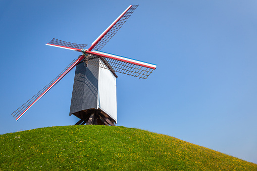 Rustic wooden windmills in Bruges public park, Belgium