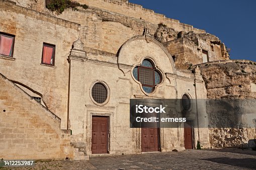 istock Matera, Basilicata, Italy: the medieval rock church San Pietro Barisano carved into the tuff, in the old town of the ancient Italian city 1412253987