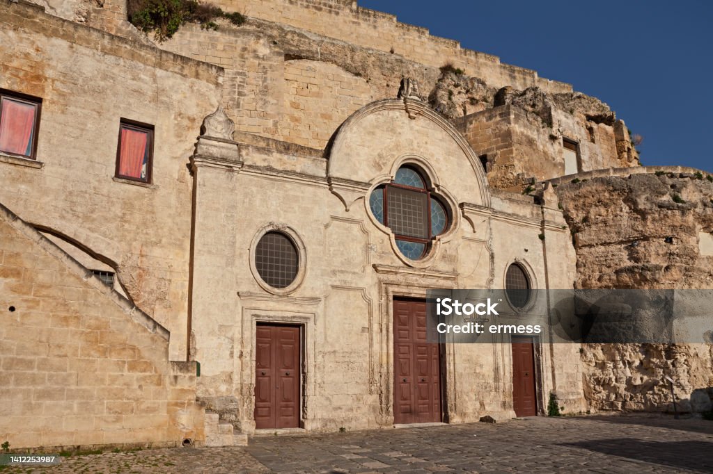 Matera, Basilicata, Italy: the medieval rock church San Pietro Barisano carved into the tuff, in the old town of the ancient Italian city Peter the Apostle Stock Photo