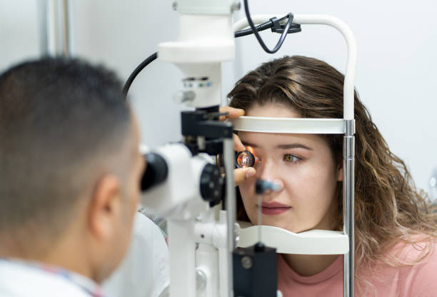 istock Ophthalmologist doing eye exam to woman 1412257496
