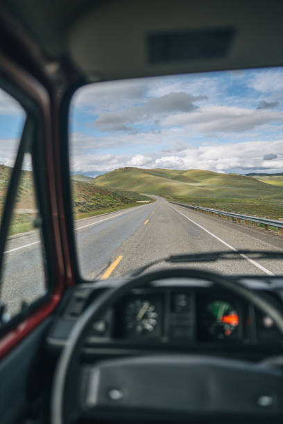 istock POV through vehicle window shield to road 1412259306