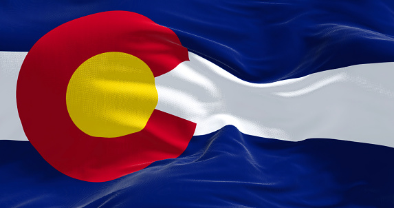 Close-up view of the Colorado flag waving. Colorado is a United States state located in the Rocky Mountains Region