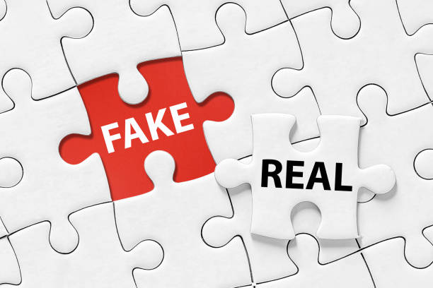 Real and fake concept Real and fake concept on jigsaw puzzle. Jigsaw puzzle with missing piece. real life stock pictures, royalty-free photos & images