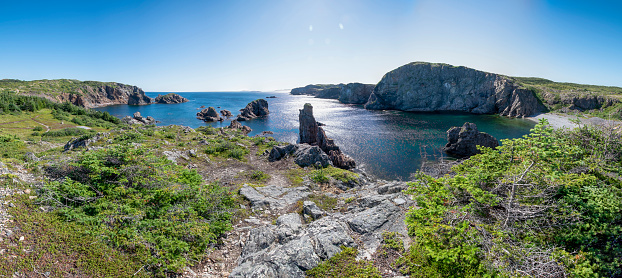 A panoramic view of Spiller's Cove near Twillingate, Newfoundland as seen from the end of the hiking trail leading up to it, on a beautiful sunny day.