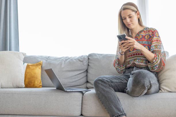 istock Beautiful young girl using smart phone 1412266413