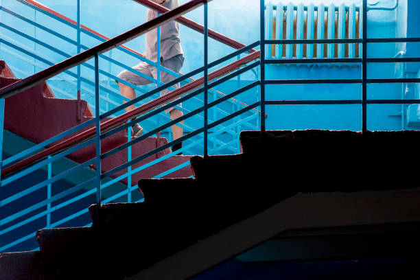 istock A man climbs the stairs inside a residential building 1412266919