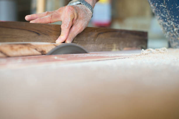 istock Woodworking, carpentry, skilled in cutting wood with a saw blade 1412267295