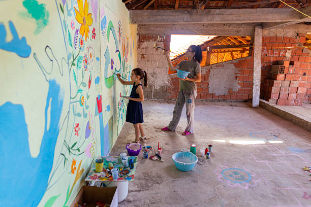 istock Cheerful mother and daughter enjoying creative time together 1412269659