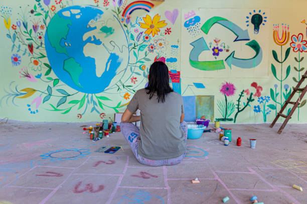 istock Artist painting on wall 1412269775