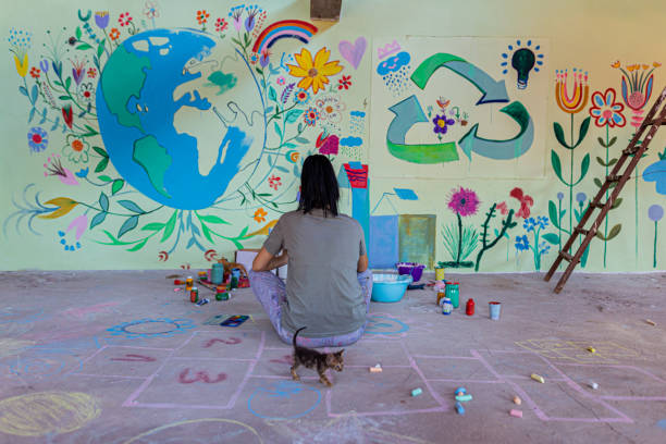 istock Artist painting on wall 1412269900