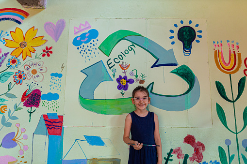 Photo of girl painting at home in art studio