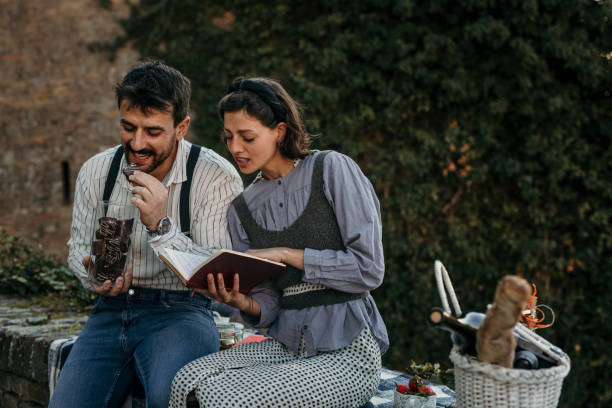istock Sitting on an old rustic brick wall, having our picnic 1412273622