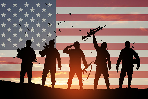 USA army soldiers on a background of sunset or sunrise and USA flag. Greeting card for Veterans Day, Memorial Day, Independence Day. America celebration. 3D-rendering.