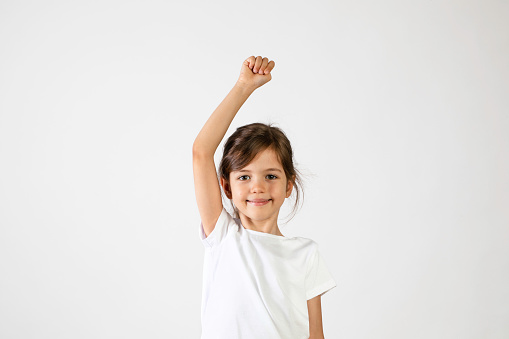 Children kid with happy expression hand up.