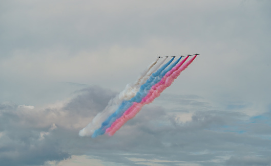 Russian Air Force planes paint the colors of the Russian flag in the sky on St. Petersburg during the celebration of the Day of the Navy
