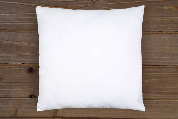 istock White Throw Pillow Mockup on Brown Wooden Background 1412278794