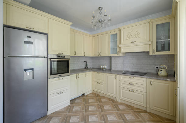 istock Interior of modern trendy cream colored kitchen 1412281127