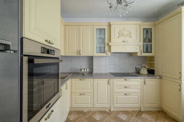 istock Interior of modern trendy cream colored kitchen 1412281145