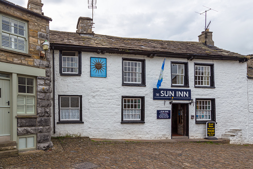 Dent, Cumbria, UK, 12 August 2018 - Facade of a stone building in the village of Dent in the Yorkshire Dales, UK