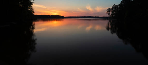 istock Glassy sunset water at Jordan Lake 1412282779