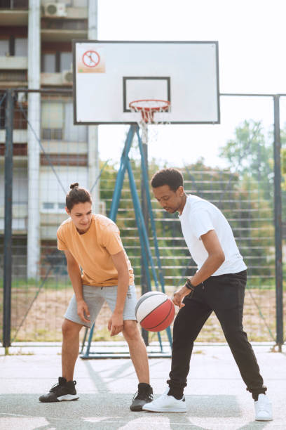 istock Friends playing basketball 1412282829