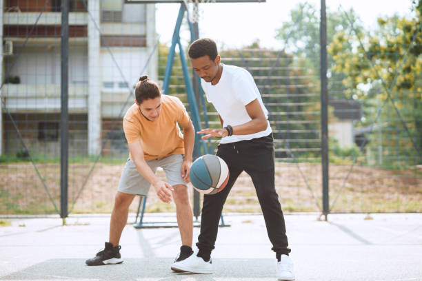 istock Friends playing basketball 1412282840