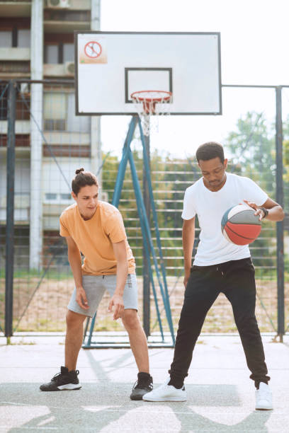 istock Friends playing basketball 1412282853