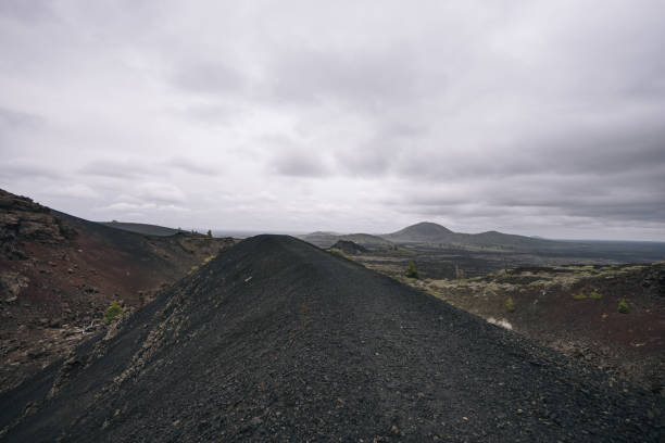 istock Road leads through old lava beds on a moody day 1412284280
